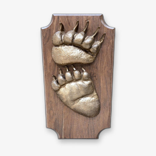 Bear plaque with carved paw detail
